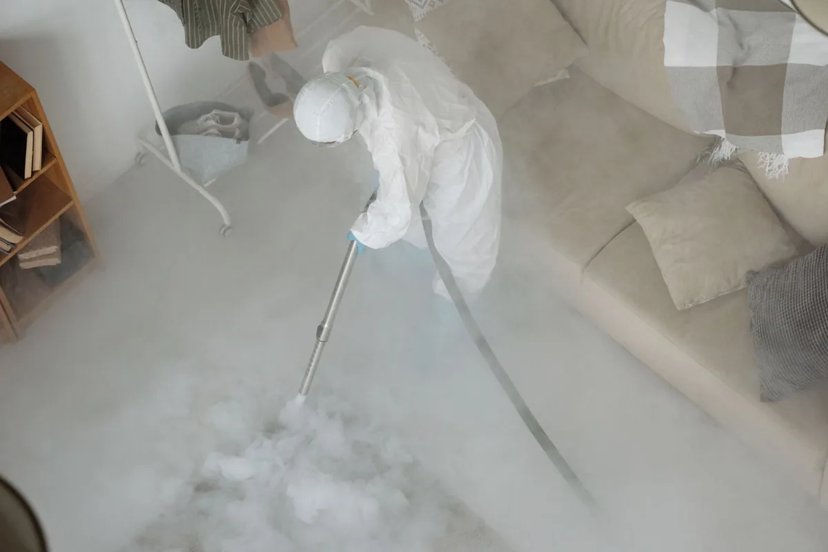 Biohazard cleanup technician in protective equipment, Mission Bend, TX